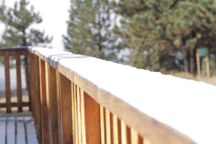 Snow lines the railing of the Grand View Bistro.