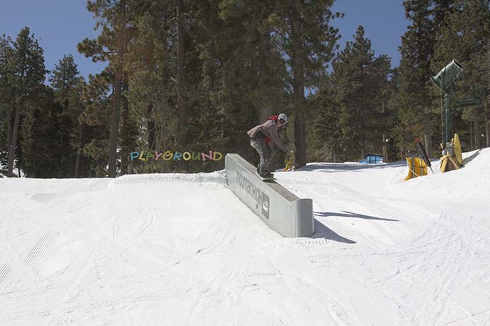 Lance hitting the concrete ledge on a sunny day.