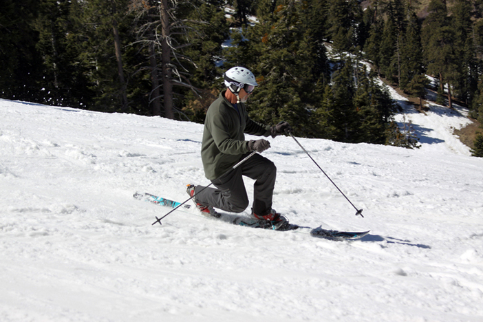 Telemark skiing and enjoying a beautiful day.