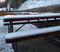 Light snow covers the sundeck.