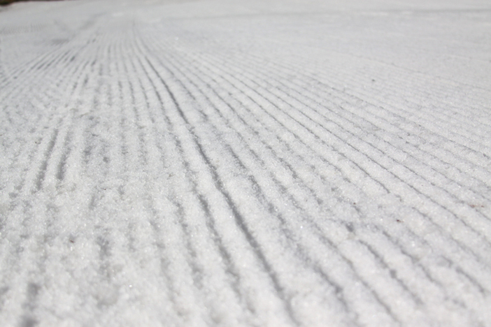 Freshly groomed corduroy on all open slopes.