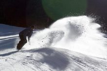 Proffit laying down a fat slash in the fresh made snow.