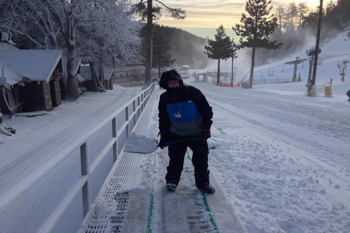 Shoveling out the moving carpet.