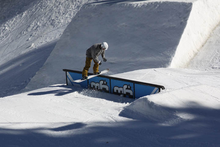 Front boarding the Double Barrel rail in the Playground.