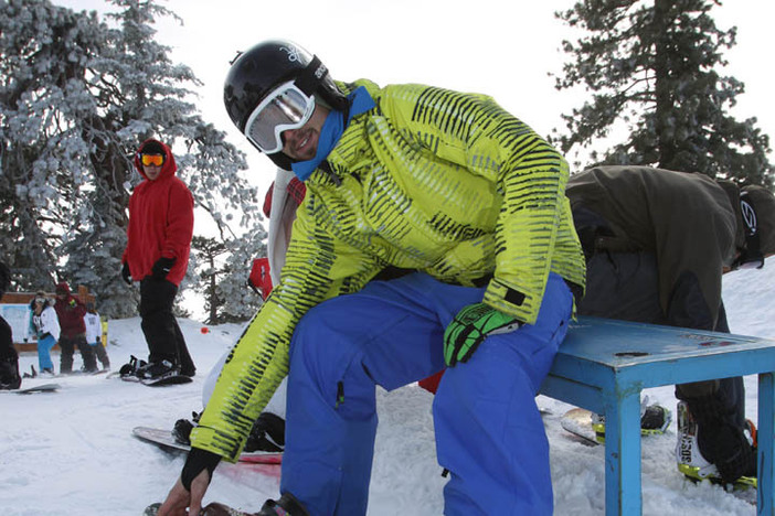 Strapping in for the first powder run of the day.