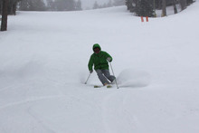 John Mccolly taking a few powder turns.