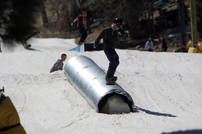 Sliding down the corrugated tube on Creekside.