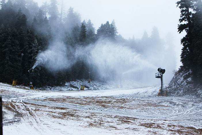 Snow falling and the snow guns blasting.