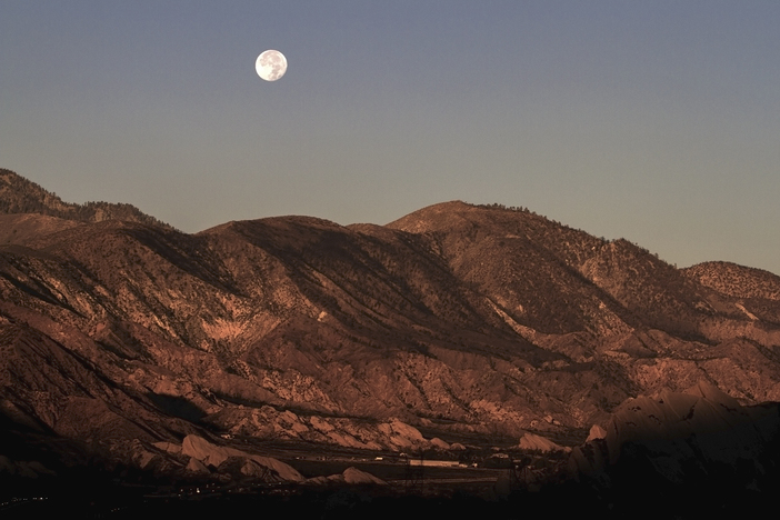 Supermoon over mormon rocks.