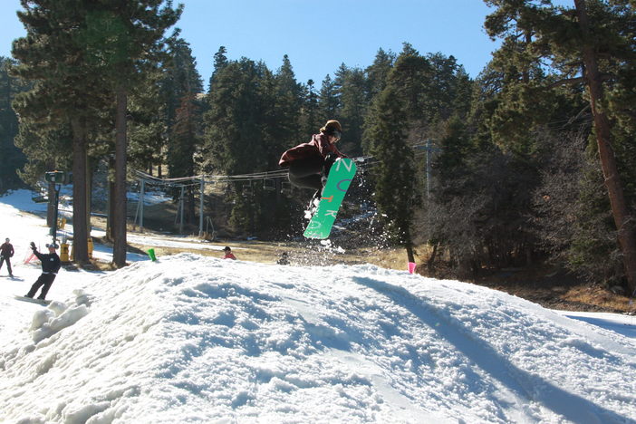 Airing off the small jumps on Creekside.