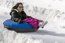 20191202 MHE Tubing smiling girl purple pants.jpg