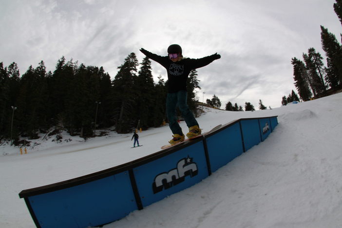 Boardslide on the flat down round rail.