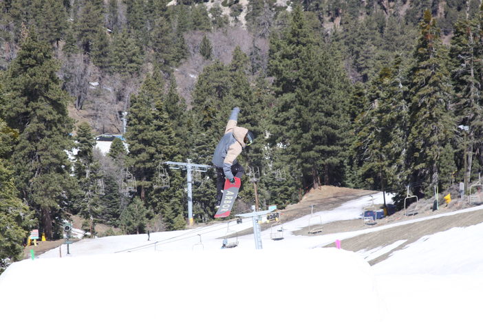 Grabbing tail off the Lower Chisolm Jump.