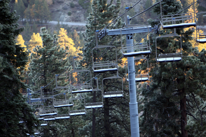 Dusting of new snow on the chairs.